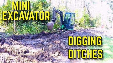 using a mini excavator for ditching|digging a ditch with a mini.